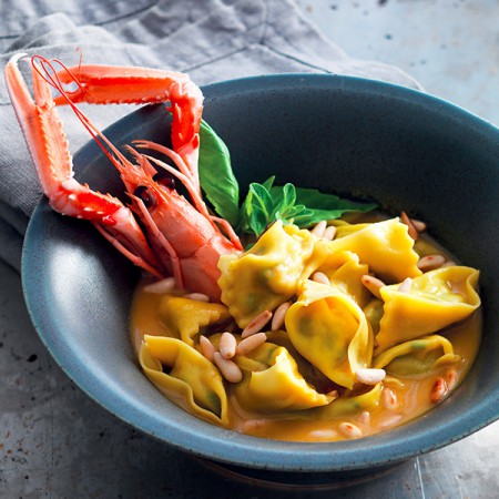 Scampi and Zucchini Ravioli with Bisque and Pine Nuts