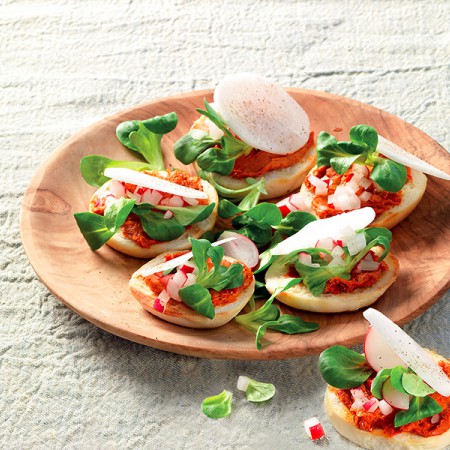 Crostini With ’nduja, Radish, and Mache Lettuce