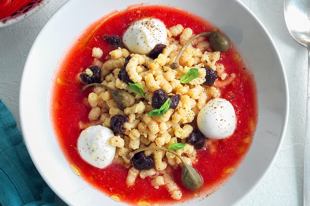 Passatelli, olives, and mozzarella in tomato broth Recipe La Cucina Italiana