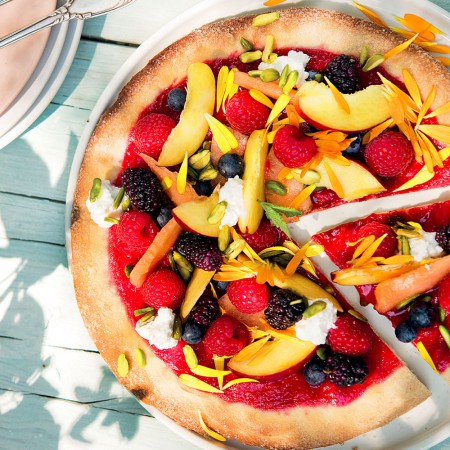 Red Dessert Pizza with Raspberries and Mixed Fruits