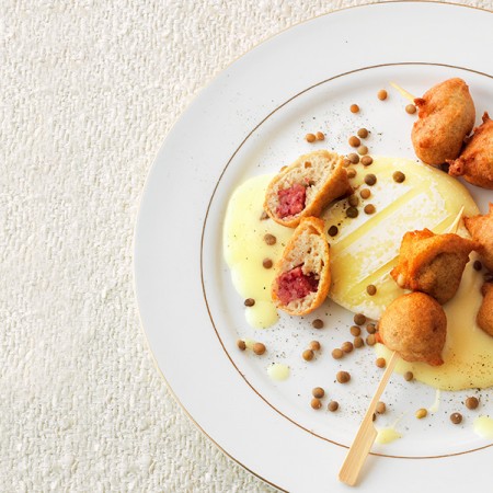 Sausage Fritter Skewers with Goat Cheese