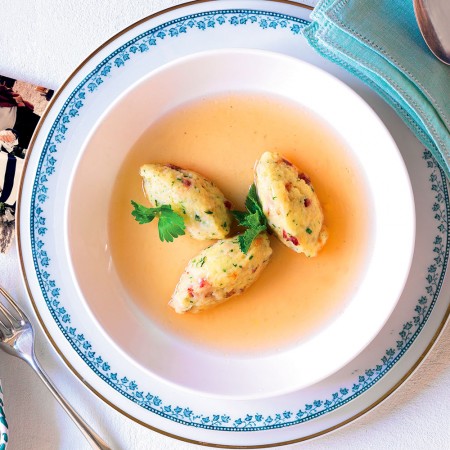 Bread gnocchi in prosciutto broth